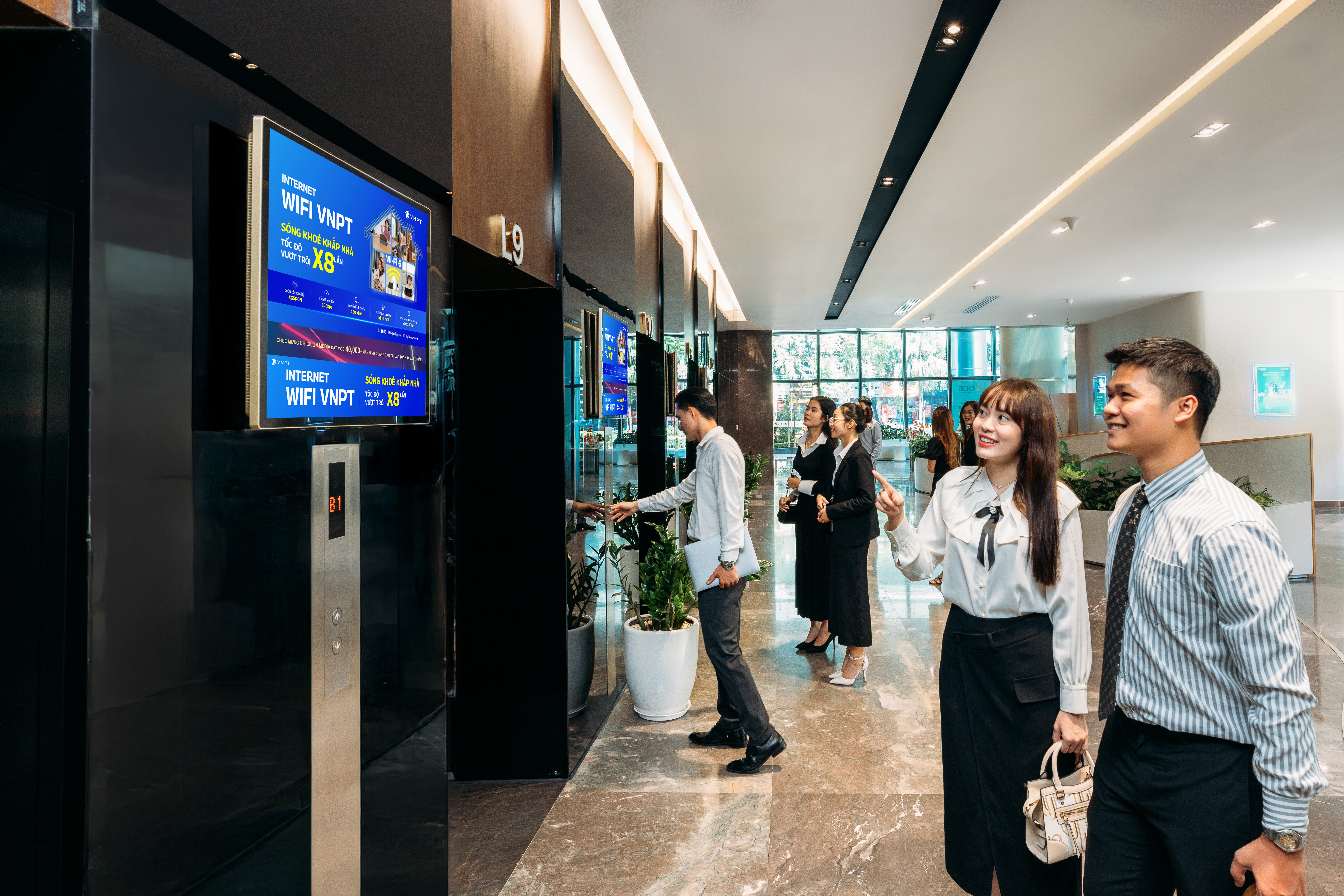Dual-screen advertising displays installed in office lobby areas