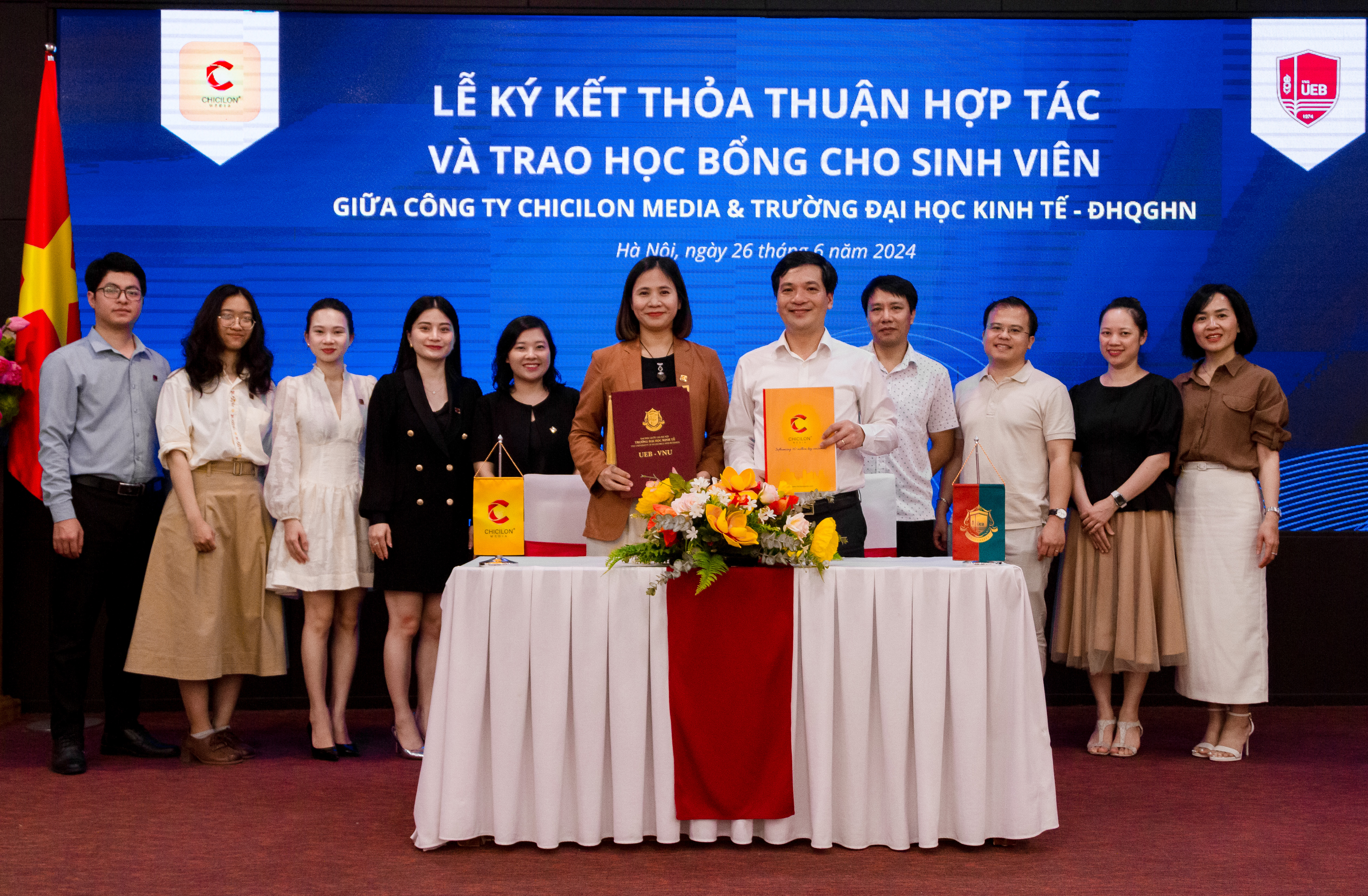 Representatives of Chicilon Media and University of Economics and Business - Vietnam National University, Hanoi, attend the signing ceremony